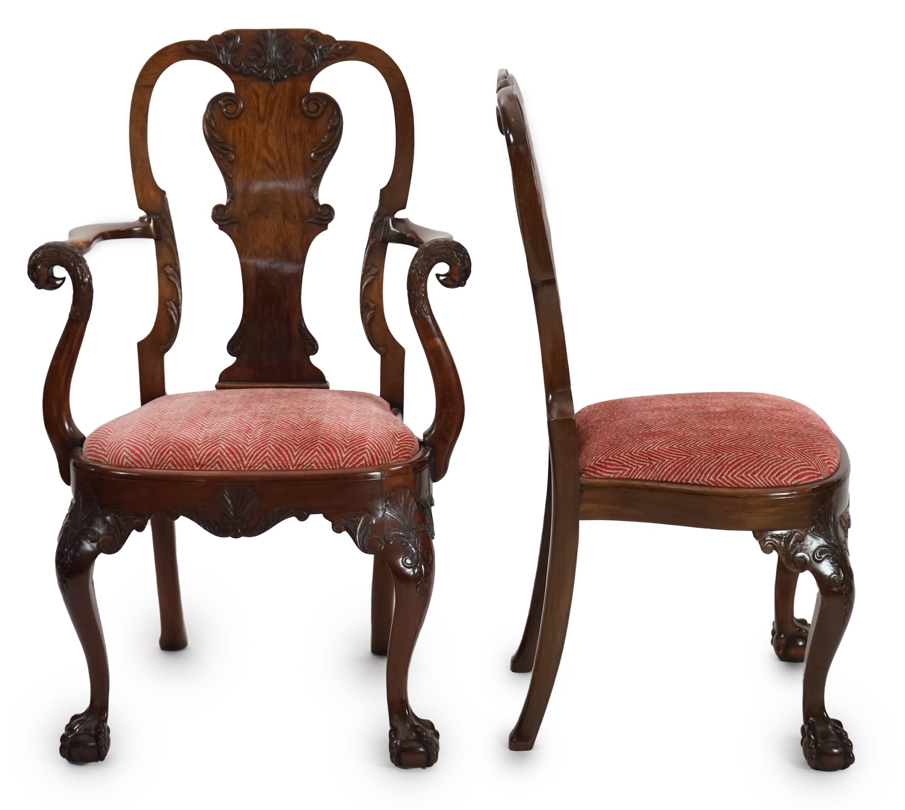 A set of twelve Queen Anne revival walnut dining chairs, including two carvers